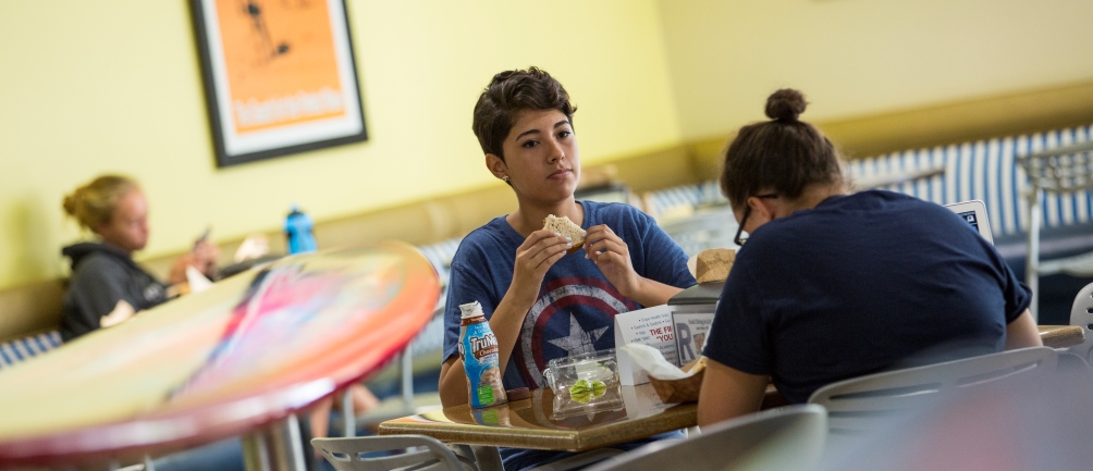 Two students eat at the Lair, Loyola Marymount University's main dining hall.